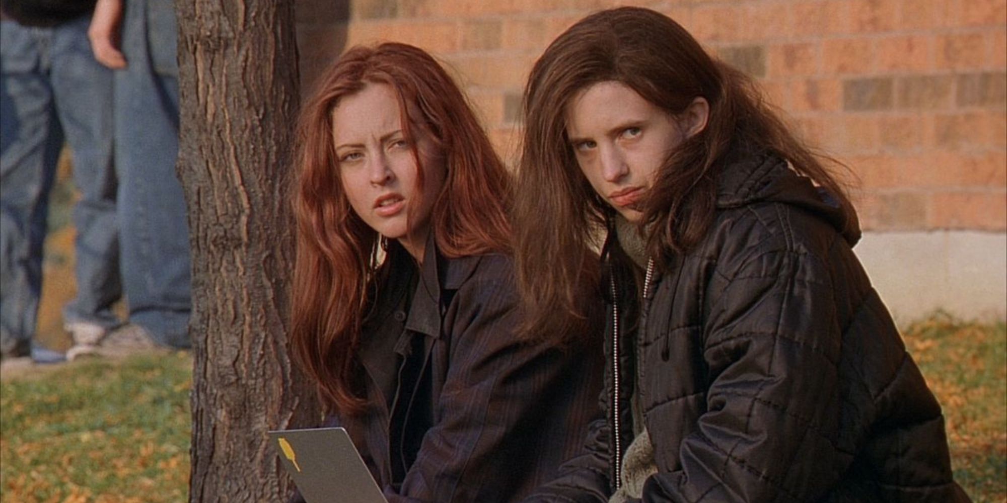 Katherine Isabelle and Emily Perkins as Ginger and Brigitte, a pair of teenage sisters from 'Ginger Snaps'