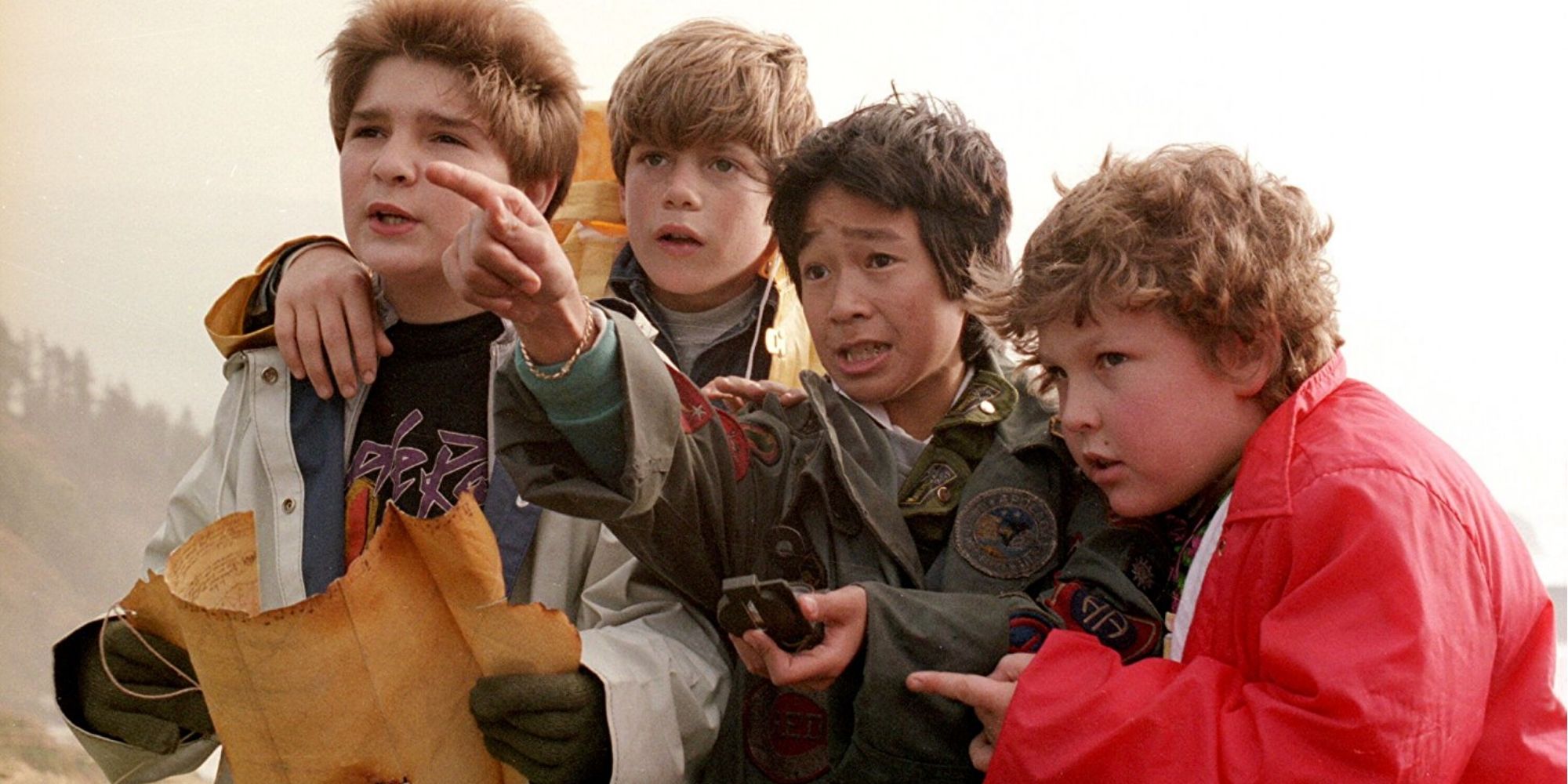 Sean Astin, Jeff Cohen, Corey Feldman and Ke Huy Quan with a map in Goonies