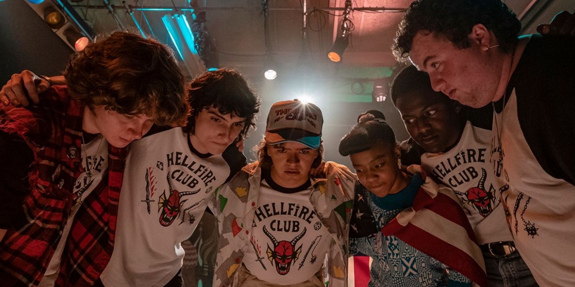 The Hellfire Club huddle together in 'Stranger Things'