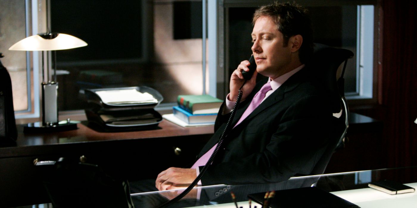 Alan Shore at his desk on the phone in Boston Legal.