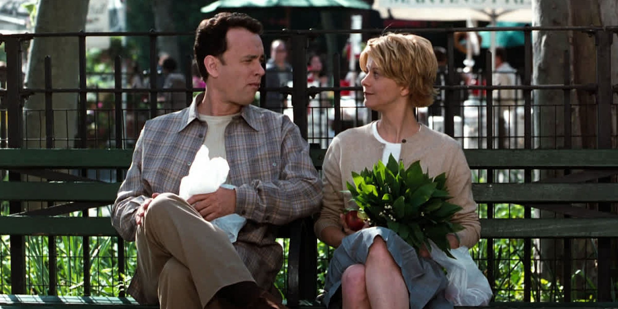 Joe Fox and Kathleen Kelly sit together on a park bench in New York in 'You've Got Mail' (1998)