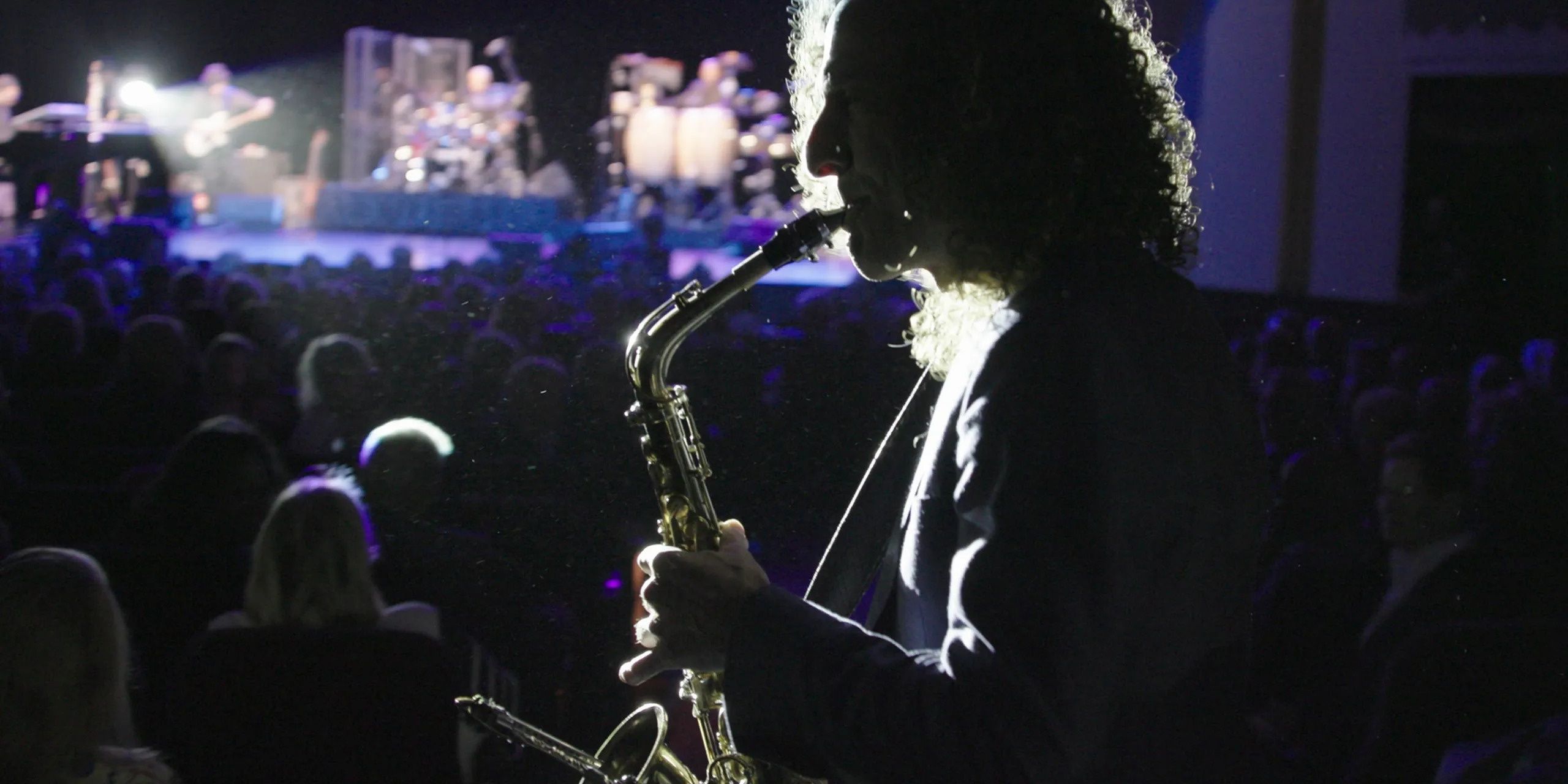 Listening to Kenny G, silhouette shot, saxophone, Directed by women, music