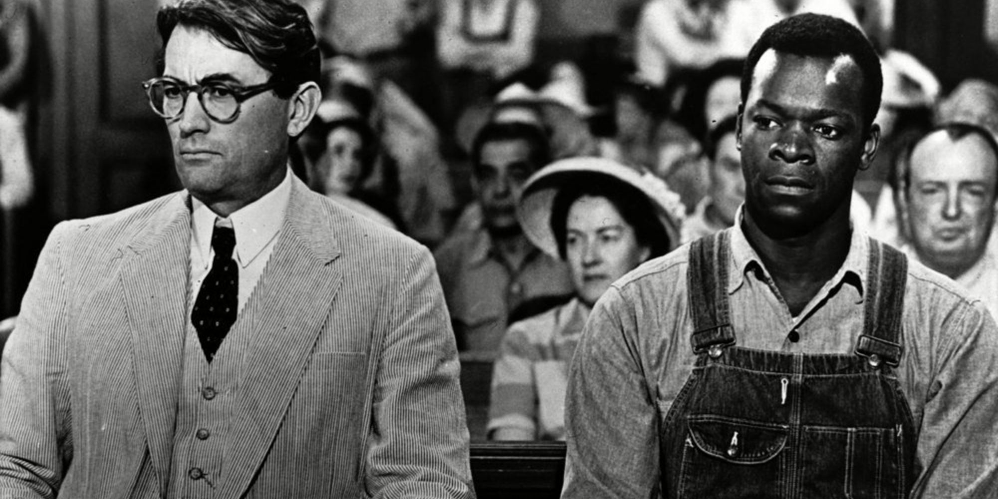 Atticus Finch and Tom Robinson await patiently in the courtroom 