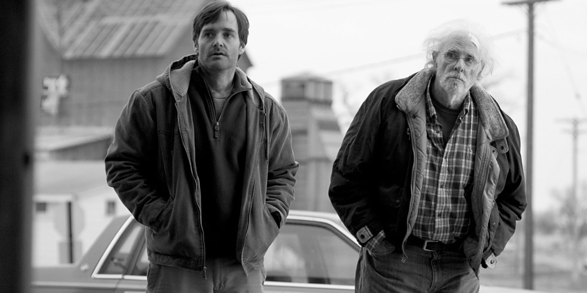 David and Woody Grant are standing outside their home, looking in the same direction at Nebraska.