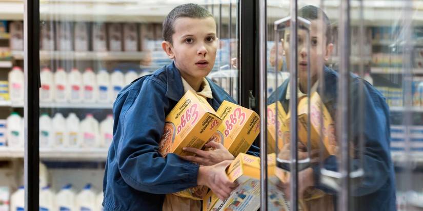 Millie Bobby Brown as Eleven stealing Eggos in Stranger Things