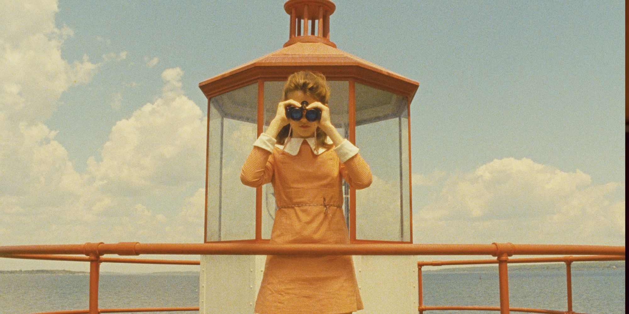 A split-screen image showing the left and right sides of a Wes Anderson film frame, highlighting the mirrored composition and vibrant color blocking