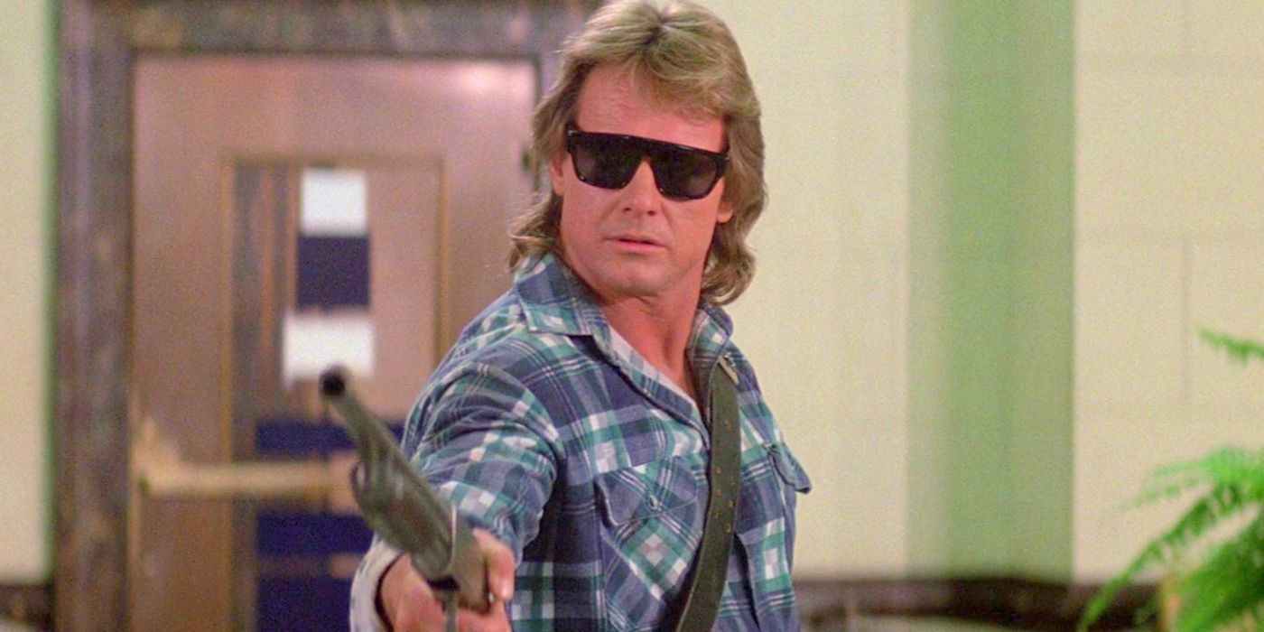 A man in shades pointing a rifle at something off-camera in They live.