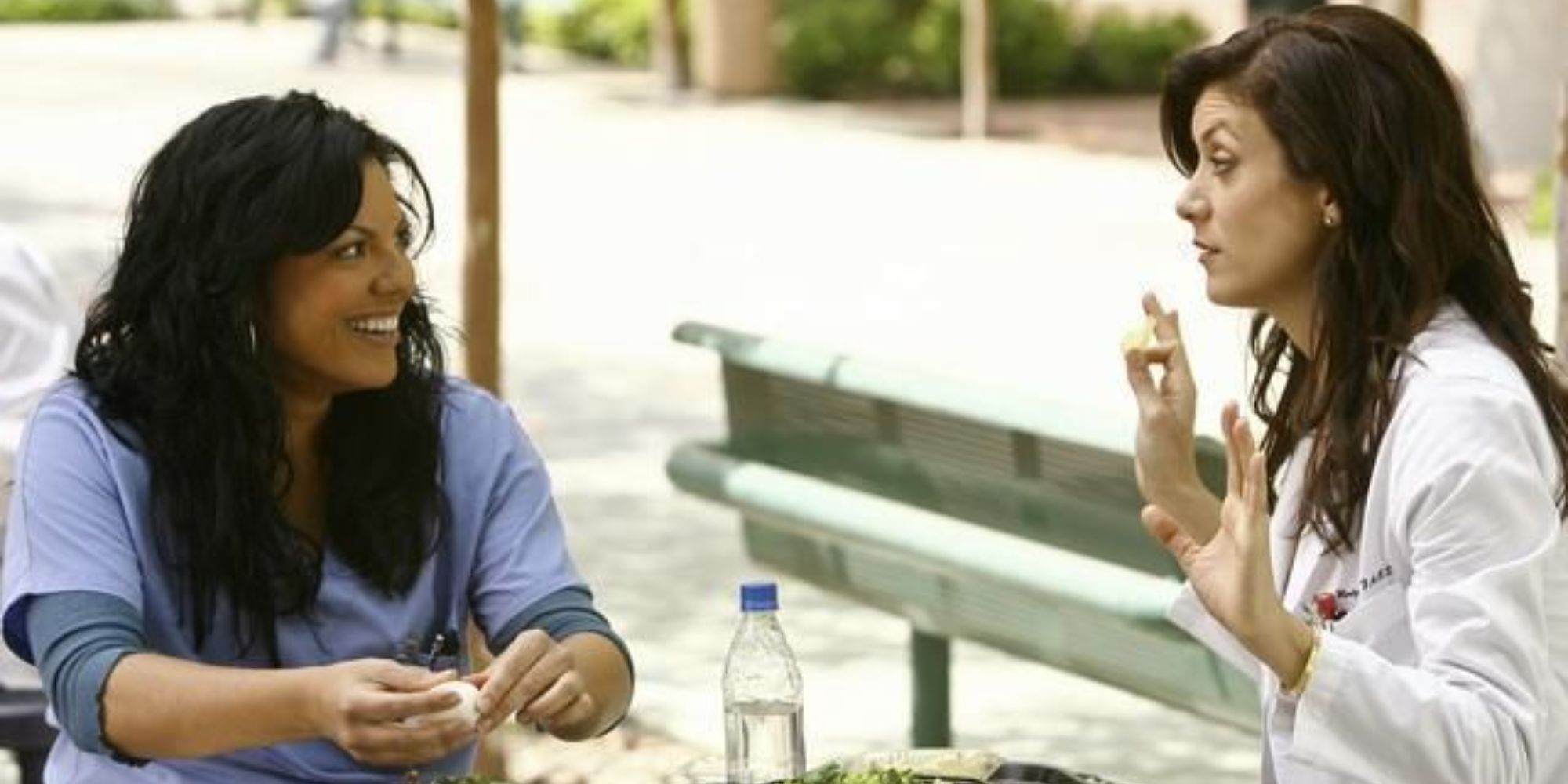 Two women are talking and laughing during lunch