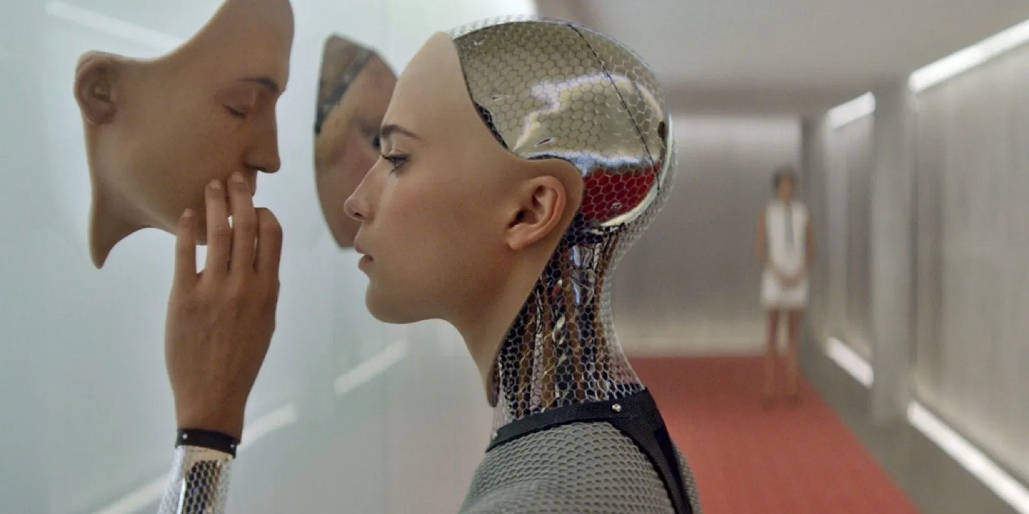 Ava looking at an A.I. prototype face in Ex Machina.