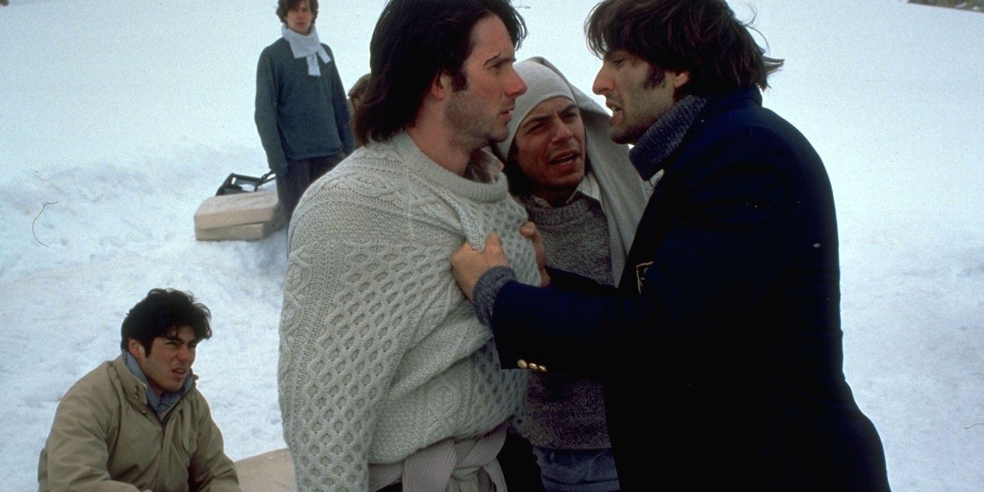 A small group of people argue in the snow in Alive, 1993.