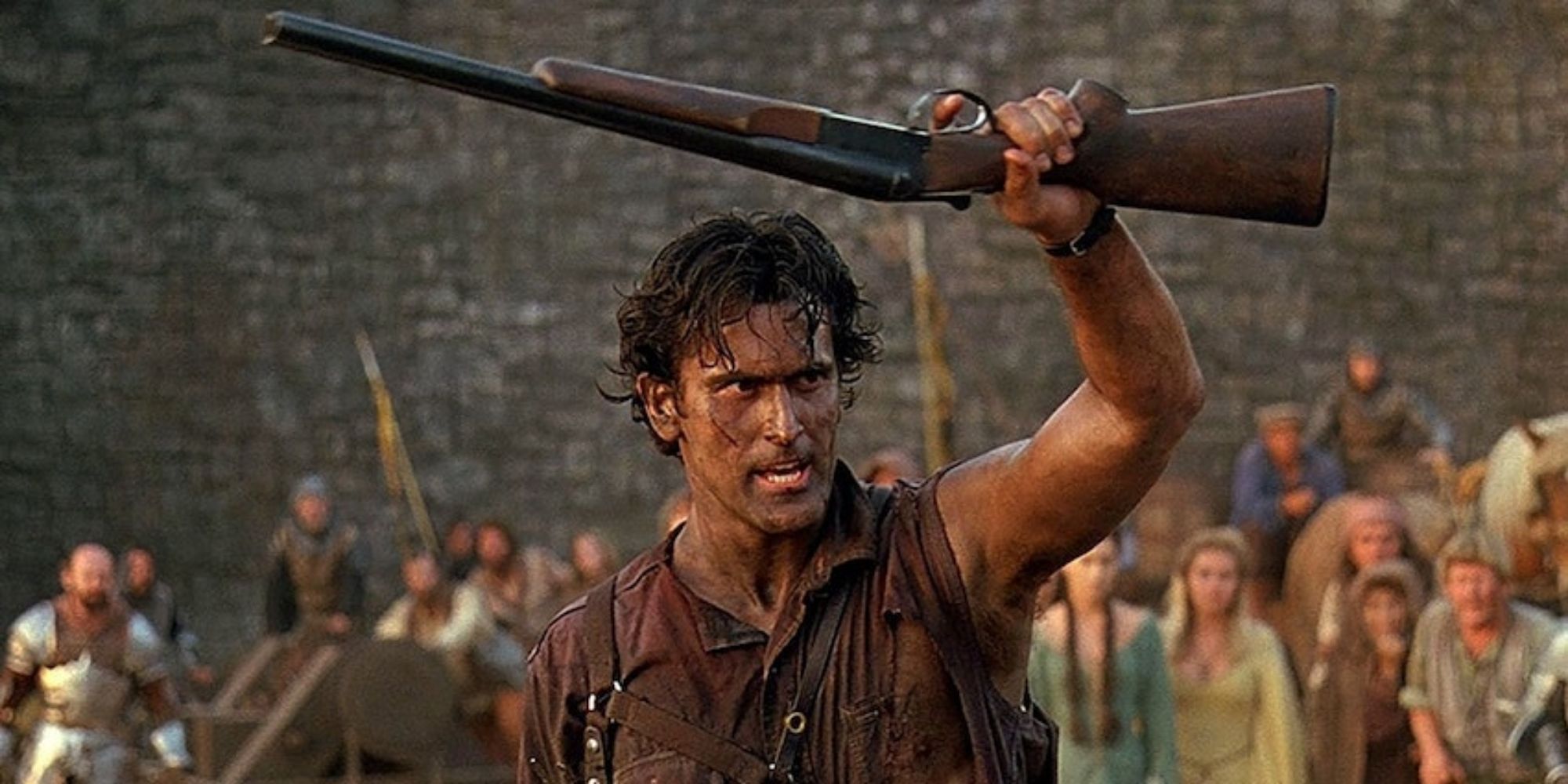 Bruce Campbell as Ash holding his boomstick in Army of Darkness