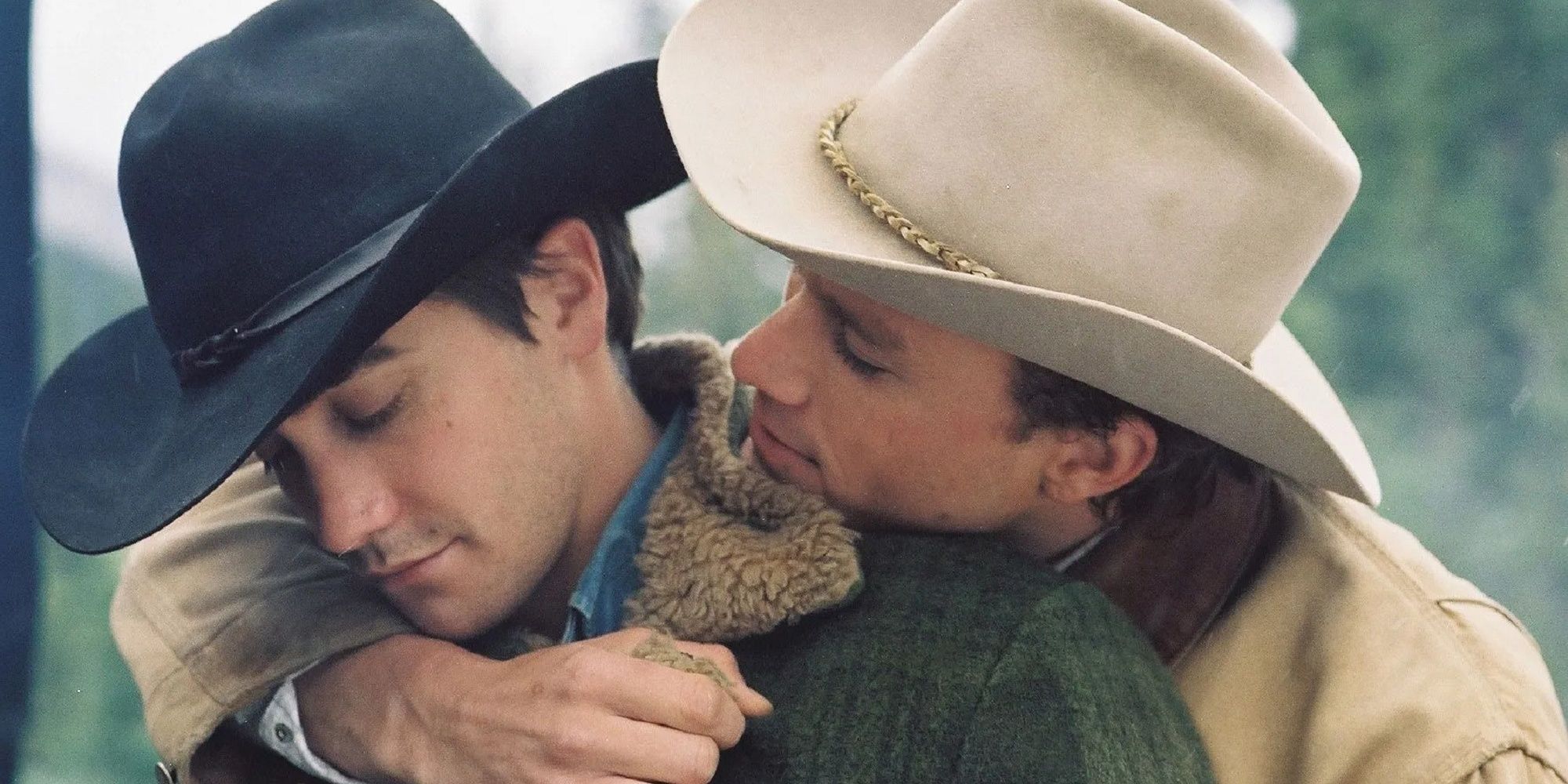 Ennis and Jack hugging on Brokeback Mountain.