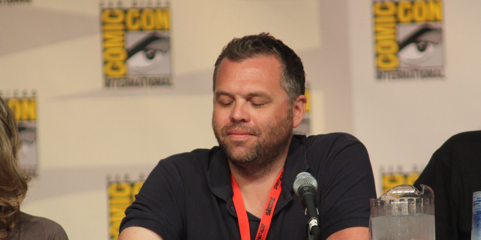 Chris McKenna with his eyes closed at a San Diego Comic Con panel