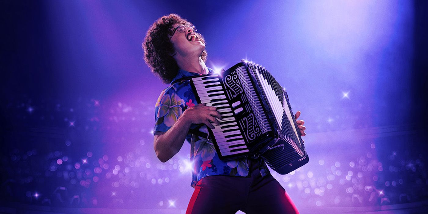 Daniel Radcliffe as Weird Al playing an accordion on a cropped poster for Weird: The Al Yankovic Story