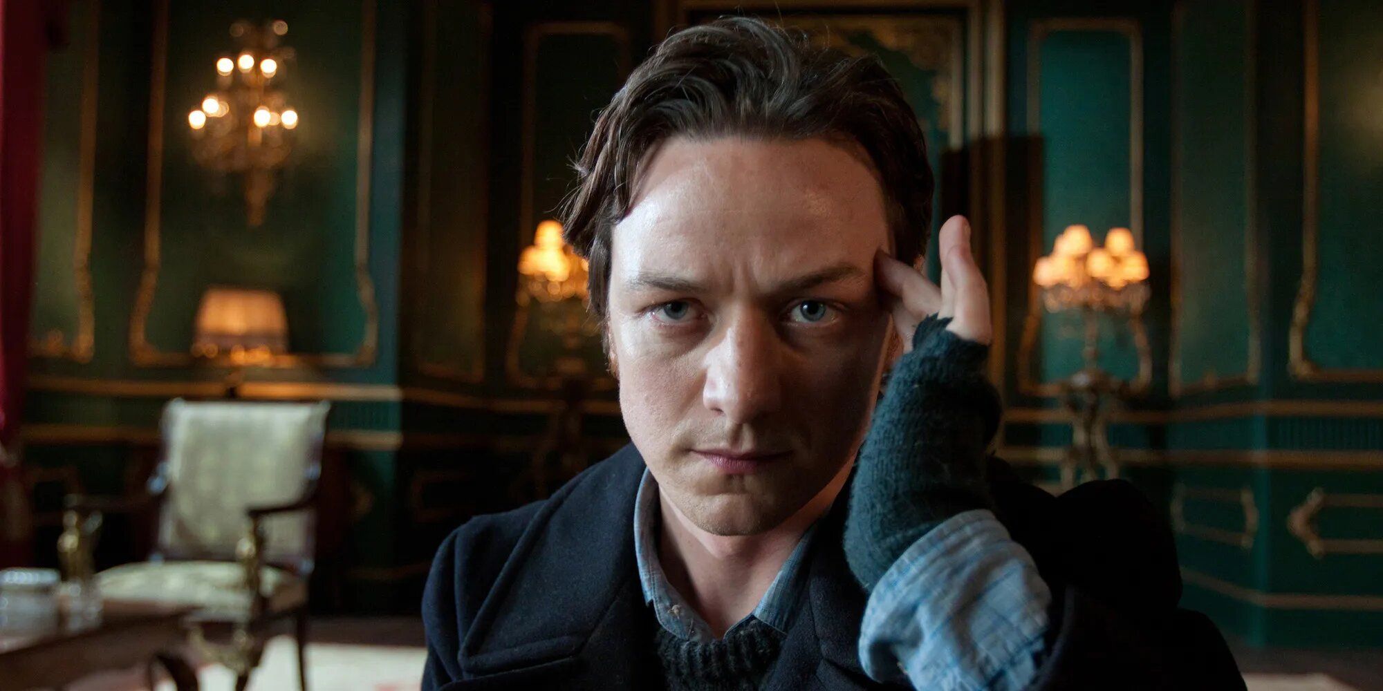 James McAvoy as Charles Xavier touching his head in X-Men: First Class