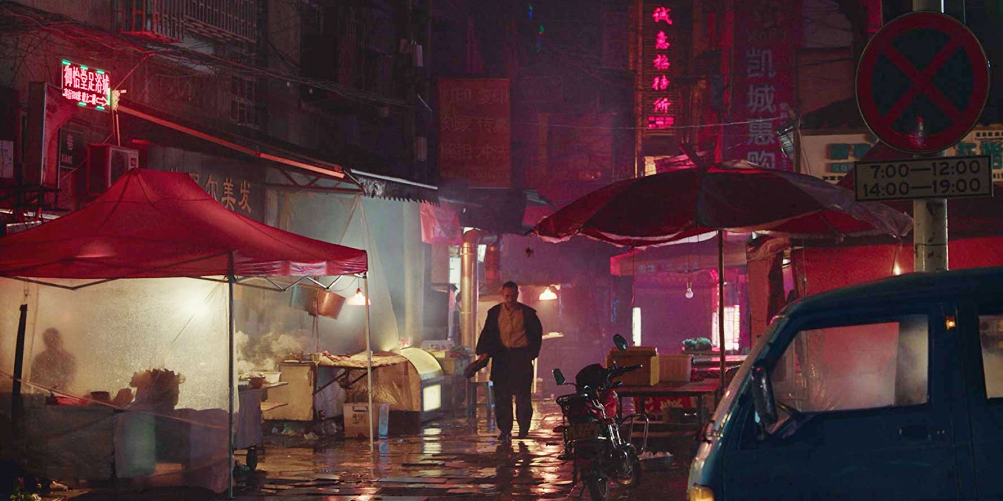 A man walking down the street in Long Day's Journey Into Night