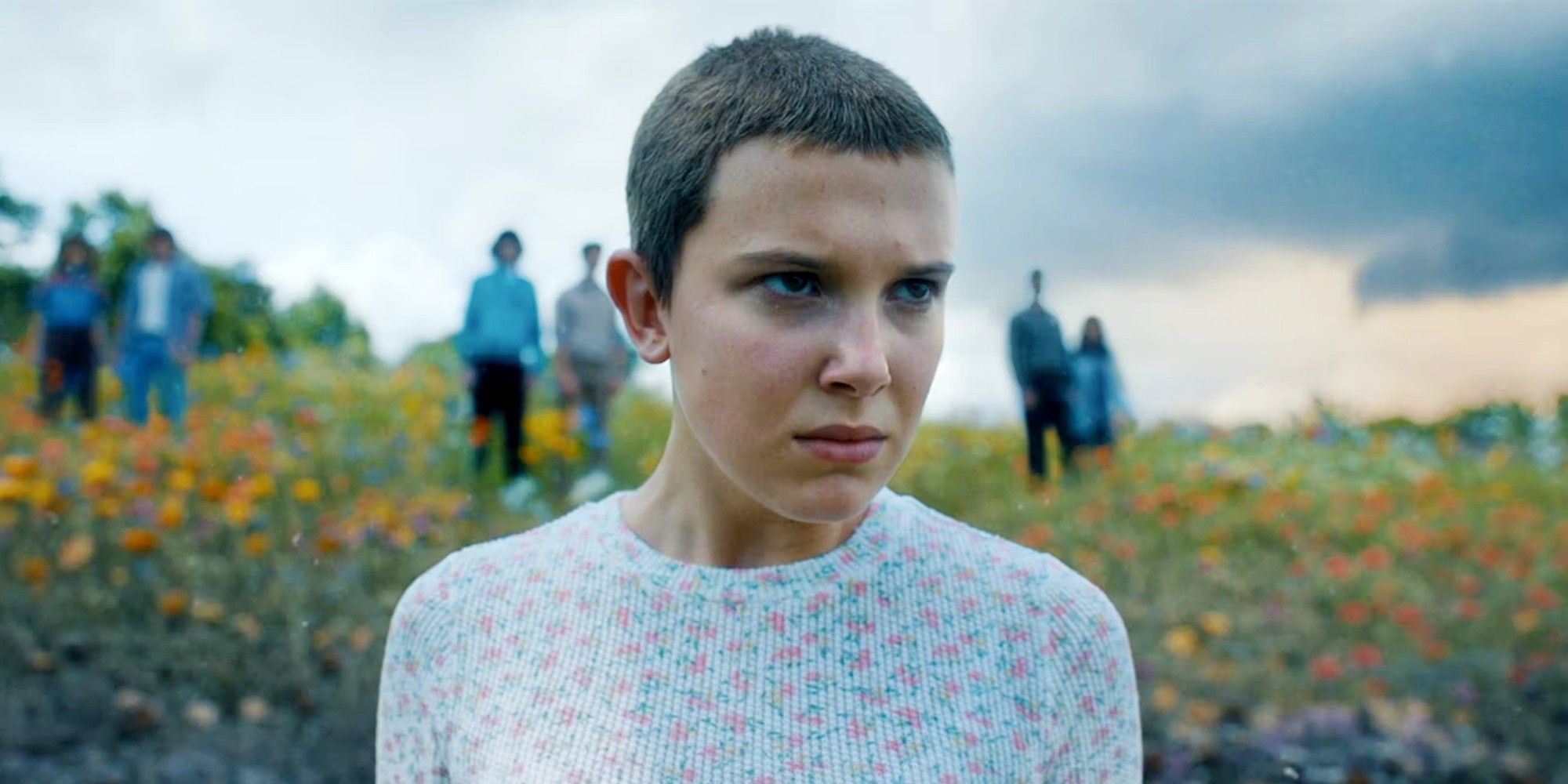 Millie Bobby Brown as Eleven looking into the distance in Stranger Things 4