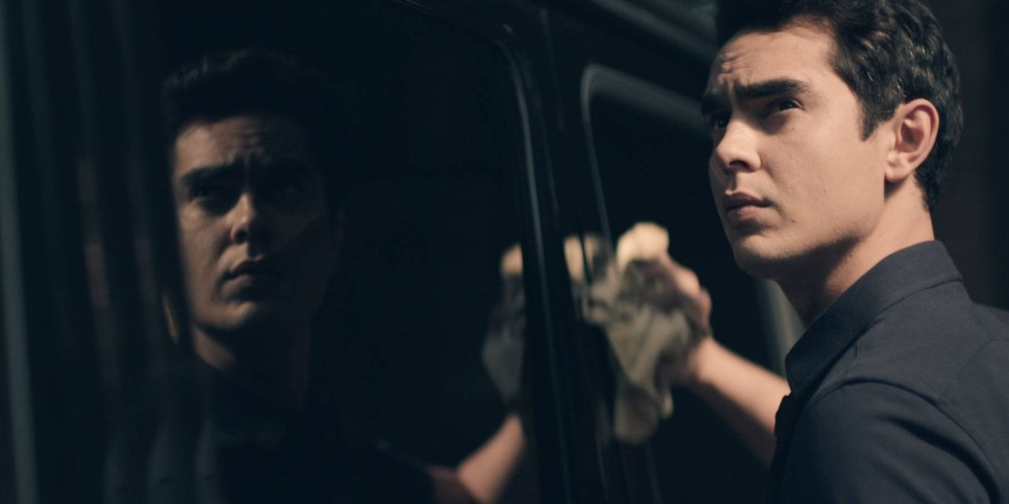 Nick cleaning a car window