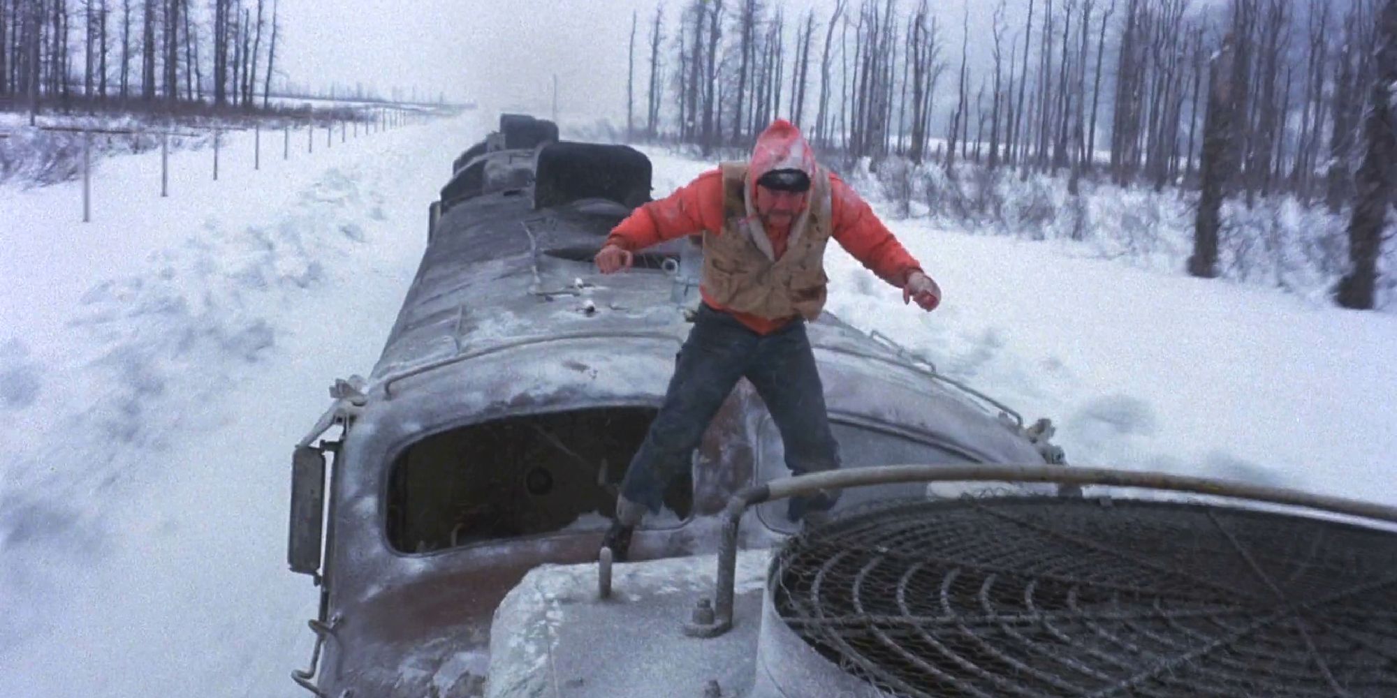 Jon Voight walks on top of a train in Runaway Train