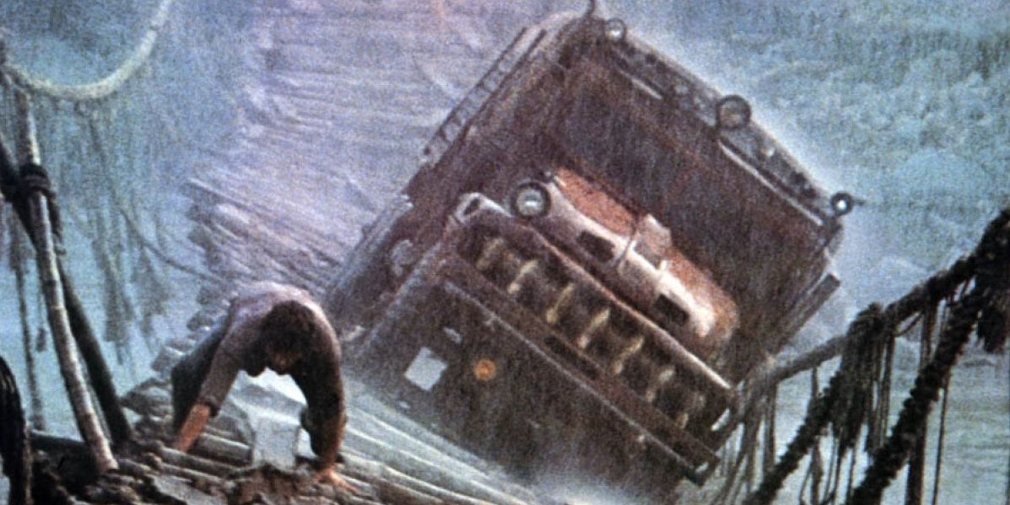 A man climbing a rickety bridge during a thunderstorm with his truck behind him in 1977's Sorcerer