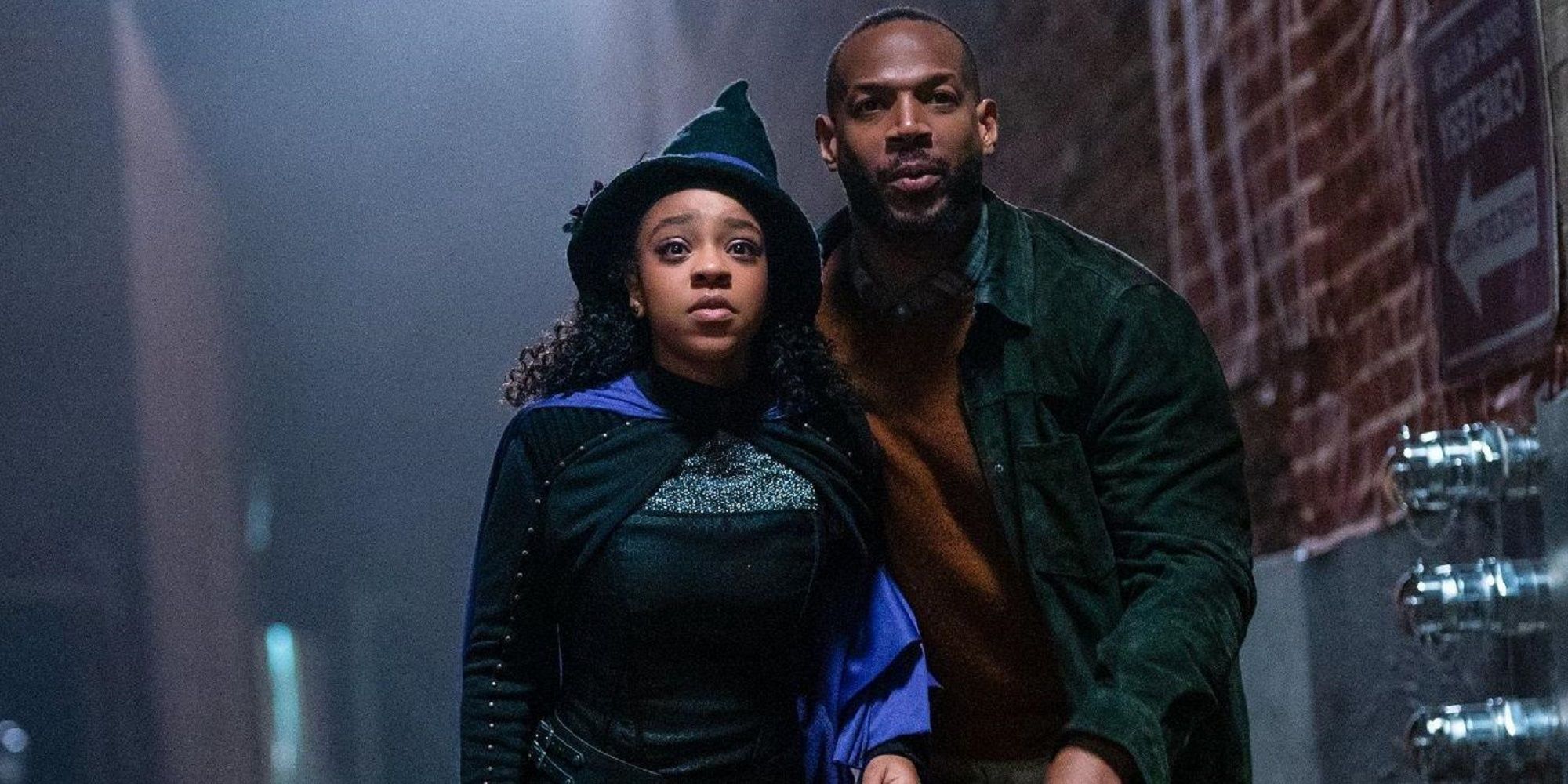 Marlon Wayans' character and his daughter looking spooked in an alley in 'The Curse of Bridge Hollow.'