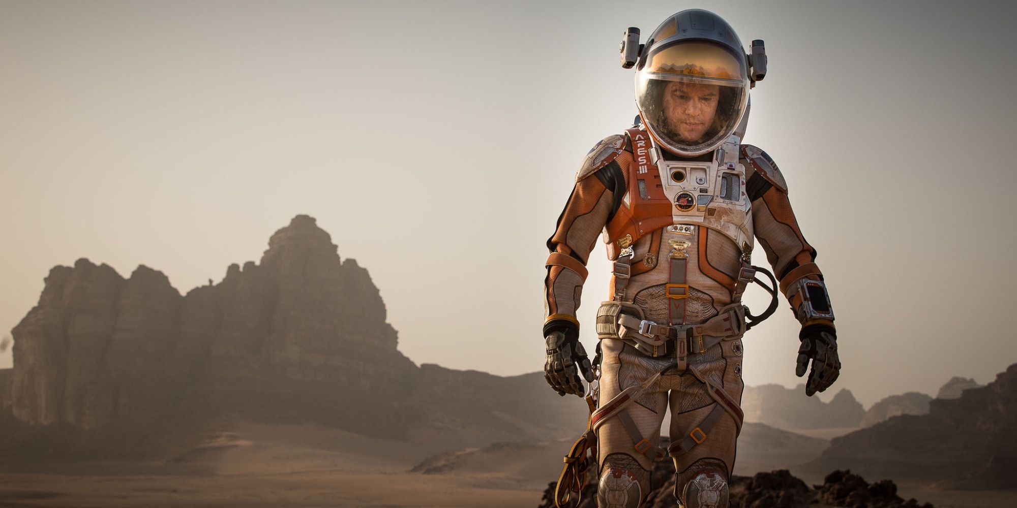 Matt Damon as Mark Watney walking alone in Mars in The Martian