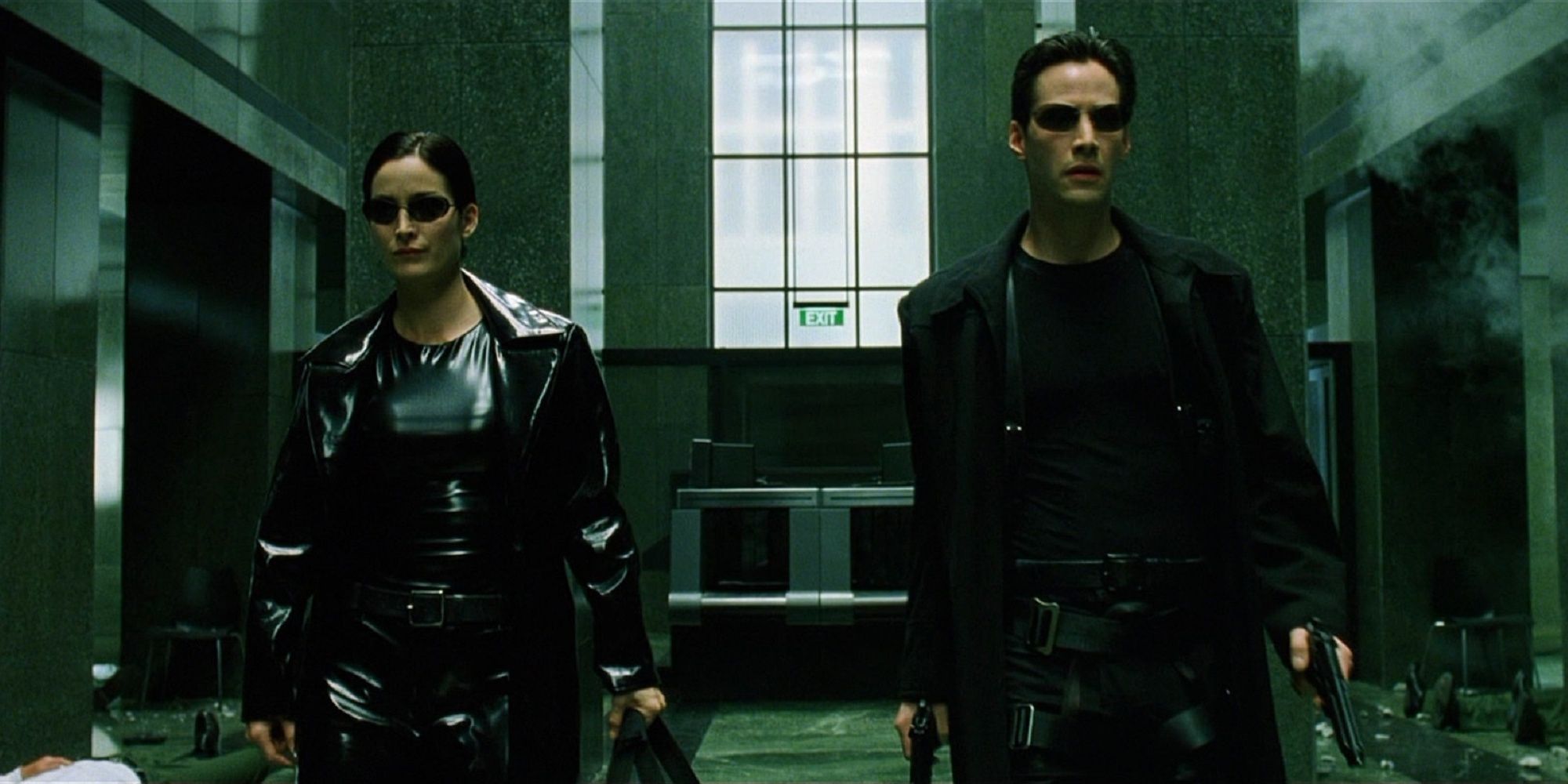 Trinity and Neo walking into building to fight in The Matrix.