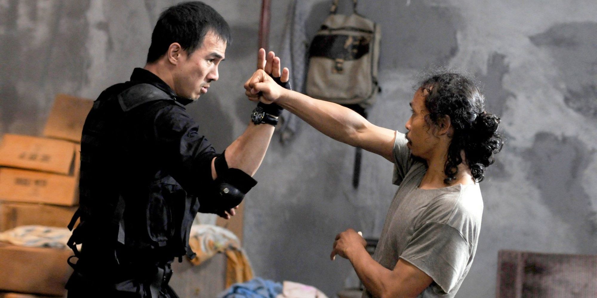 Two men exchanging blows in Gareth Edwards' 'The Raid: Redemption' (2011)