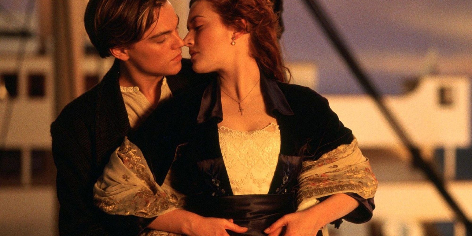 Jack and Rose kissing at the front of the ship in Titanic.