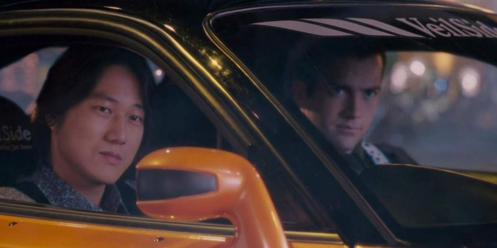 Sung Kang and Lucas Black in a car in Tokyo Drift