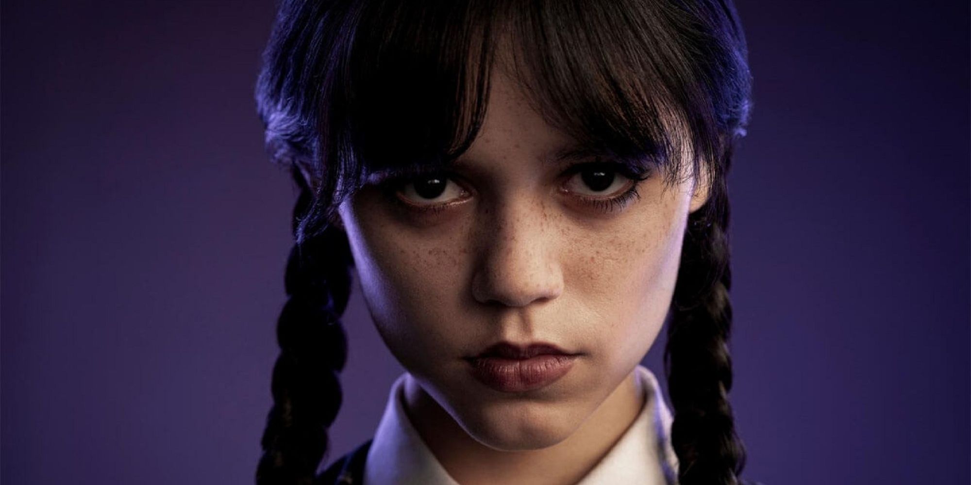 Jenny Ortega looking into the camera as Wednesday Addams in Tim Burton's 'Wednesday.'