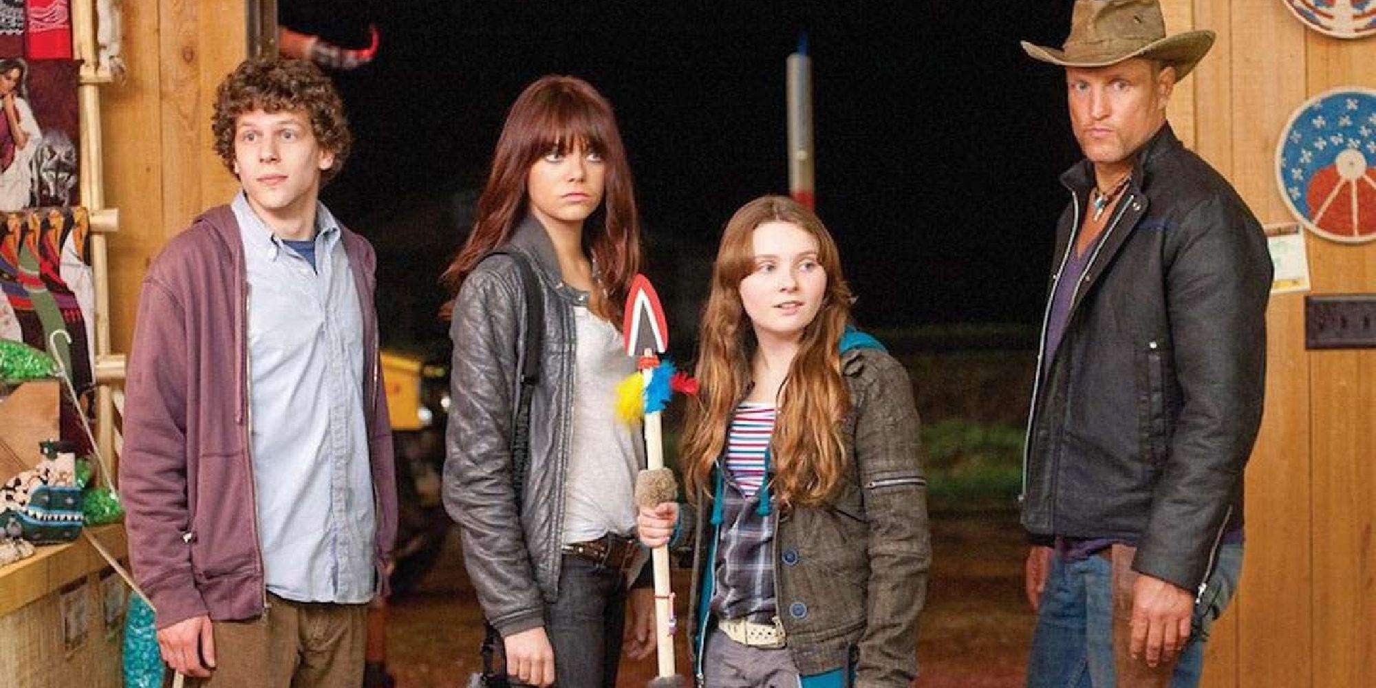 Colombus, Wichita, Little Rock, and Tallahassee standing in line and looking ahead in Zombieland