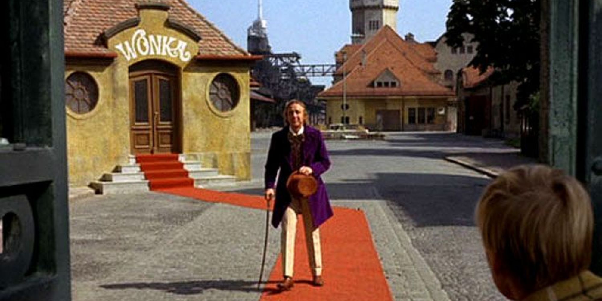 Willy Wonka (Gene Wilder) stands dizzily, moments before dropping into a somersault
