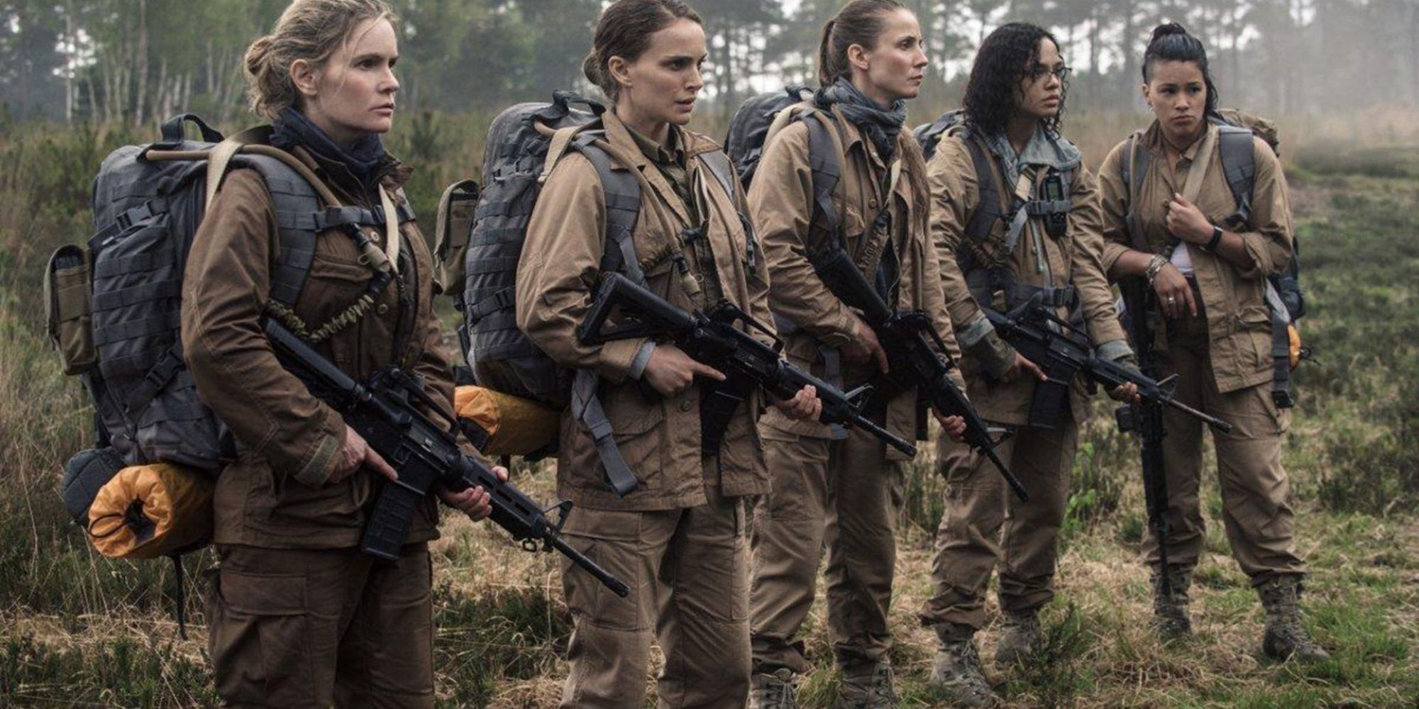 A group of female soldiers armed with guns standing in line in Annihilation.