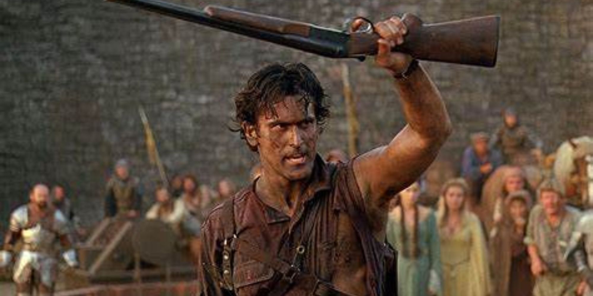 An injured Ash raises a rifle with his left hand in Army of Darkness