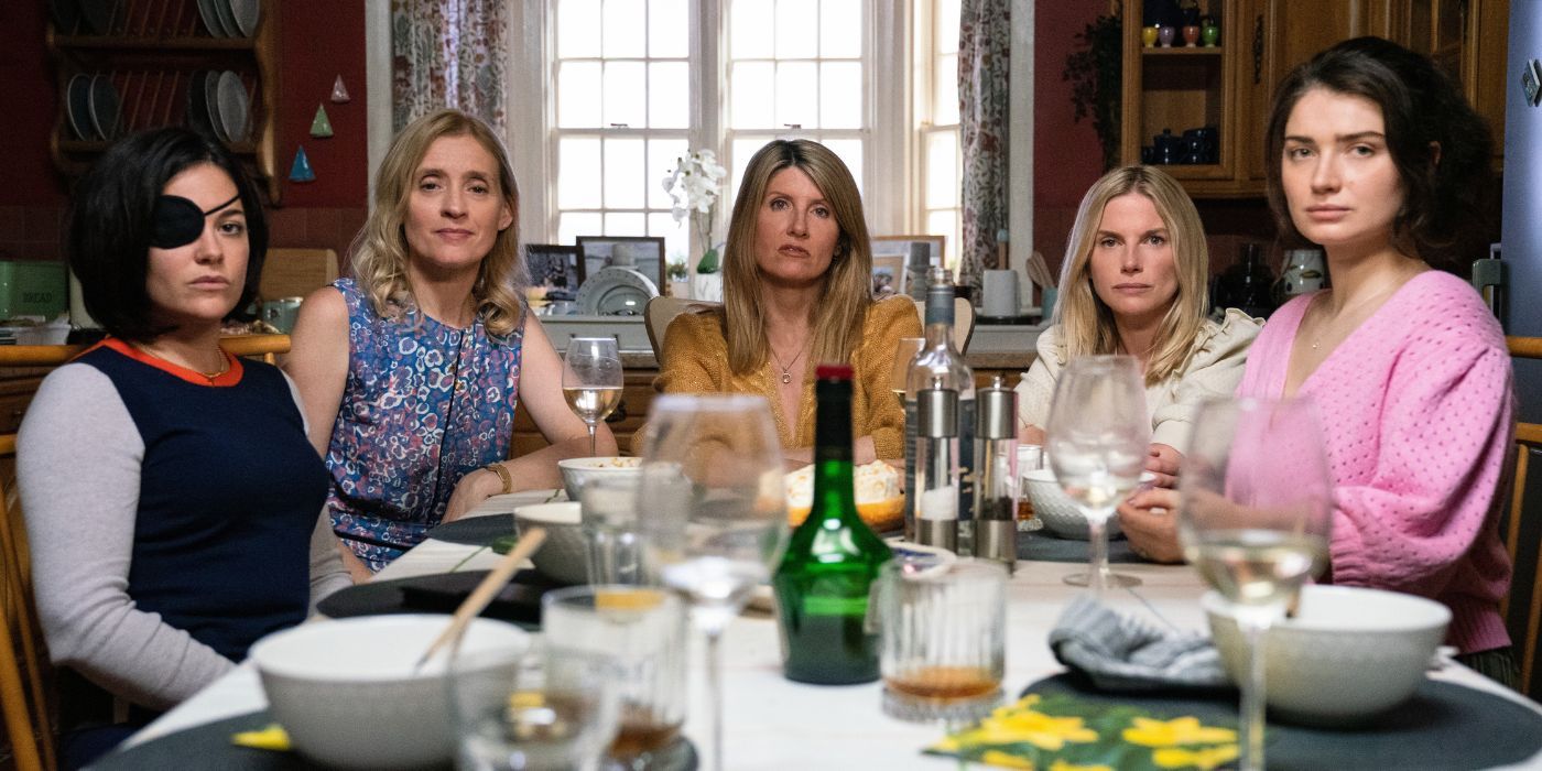 Five sisters sit around the dinner table in Bad Sisters.