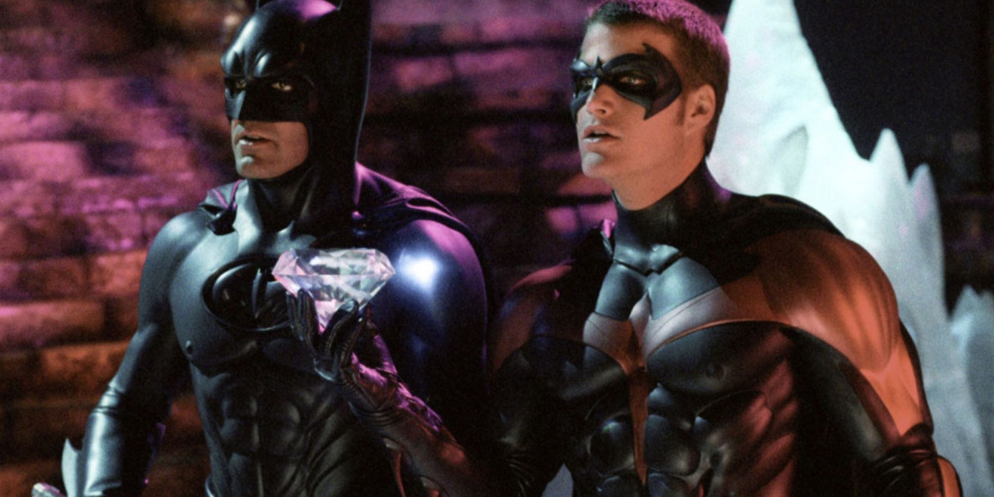 George Clooney and Chris O'Donnell as Batman and Robin looking in the same direction in Batman & Robin.