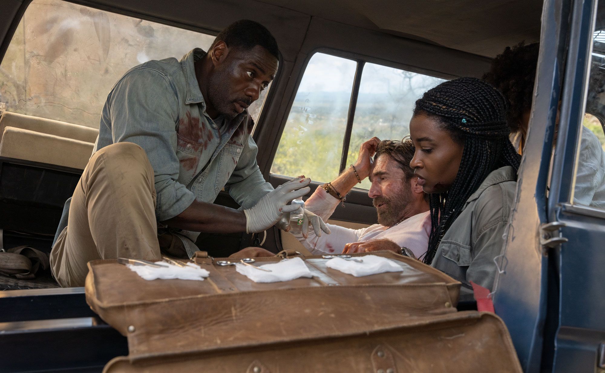 Idris Elba, Sharlto Copley and Iyana Halley in Beast