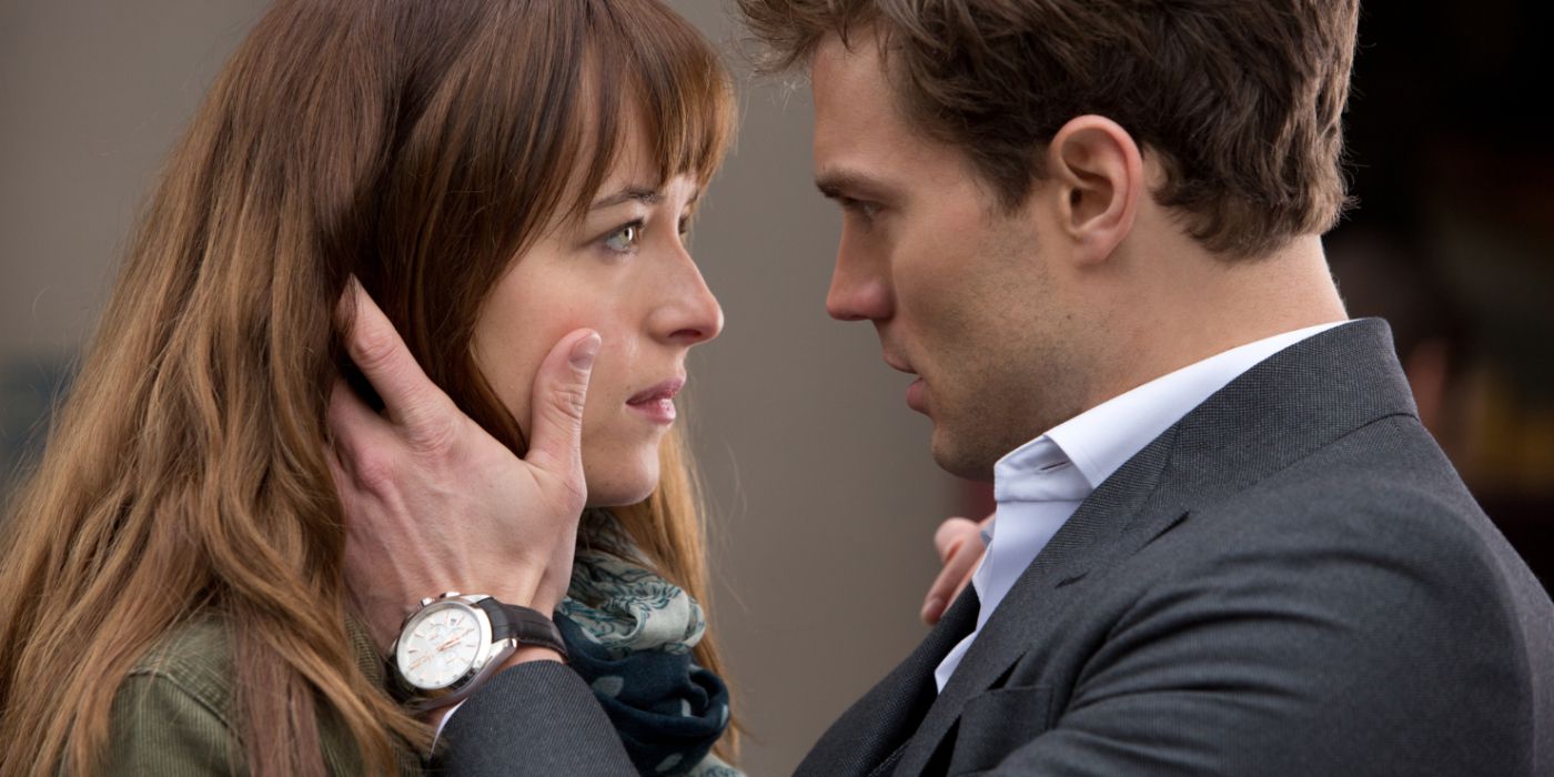 Dakota Johnson and Jamie Dornan as Anastasia and Christian staring into each others eyes in Fifty Shades of Grey