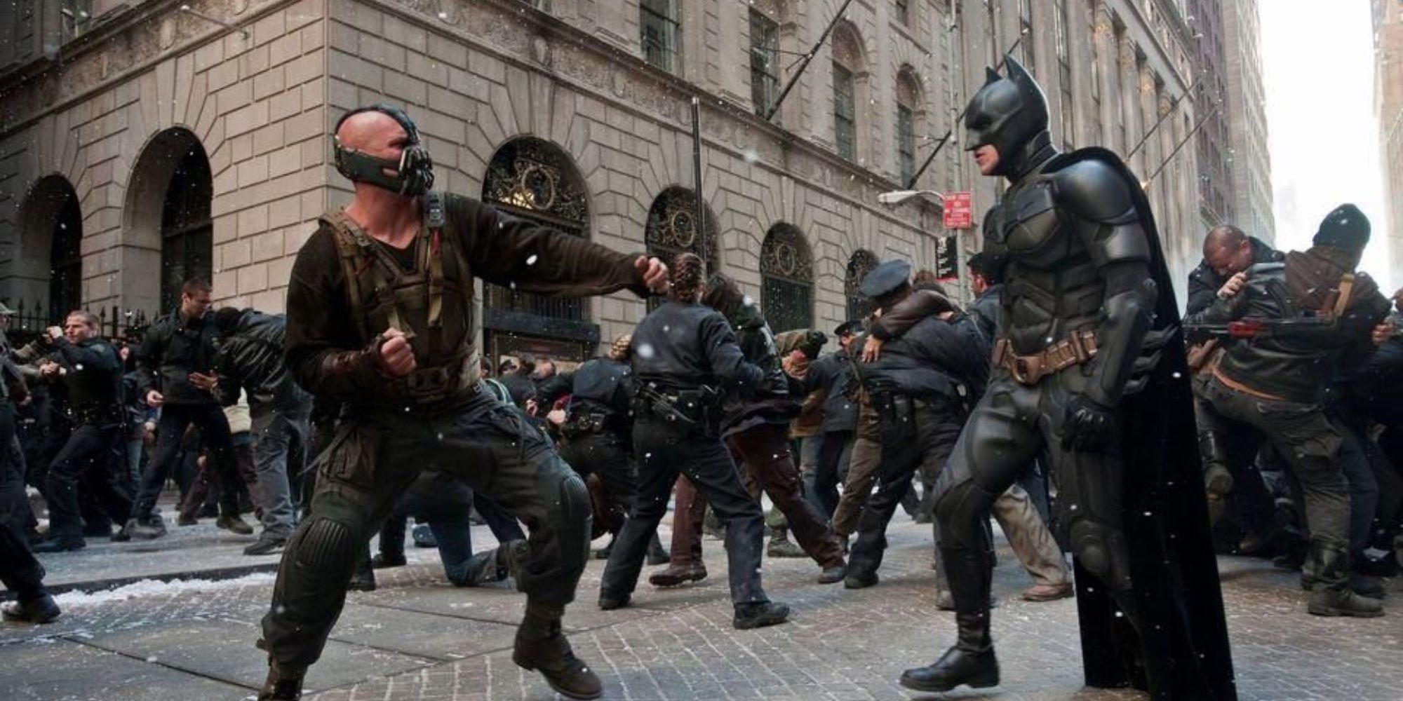 Tom Hardy (left) as Bane and Christian Bale (right) as Batman, fighting