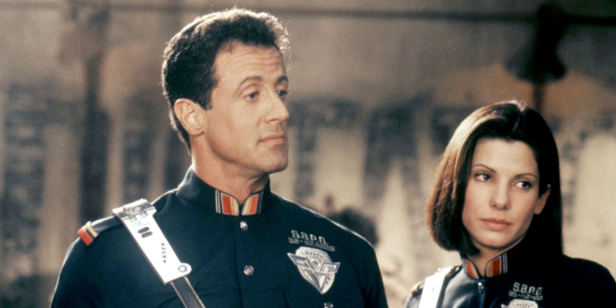 Sylvester Stallone and Sandra Bullock as police officers John Spartan and Lenina Huxley in the futuristic Demolition Man