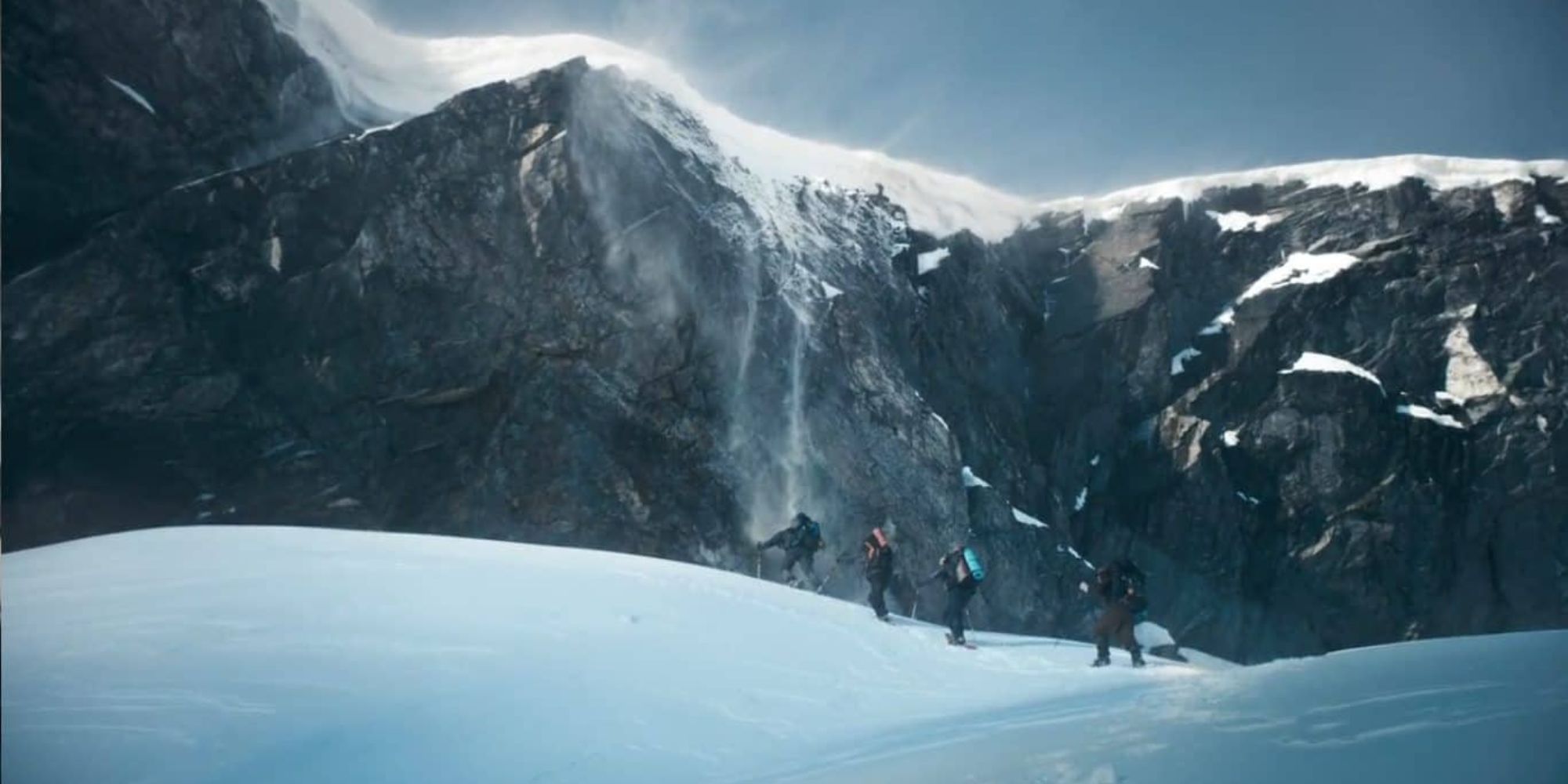 A group of skiiers ascends the mountains into Dyatlov Pass