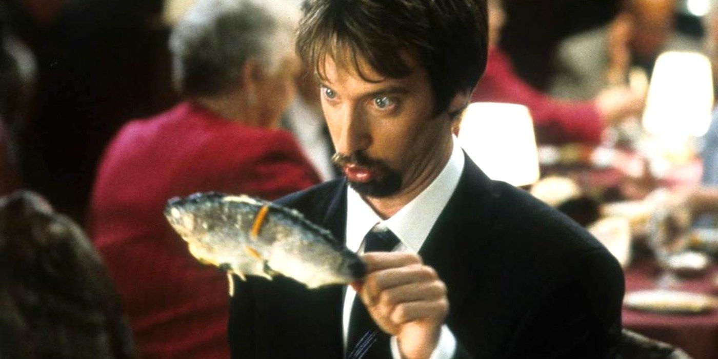 Tom Green holding a fish in Freddy Got Fingered