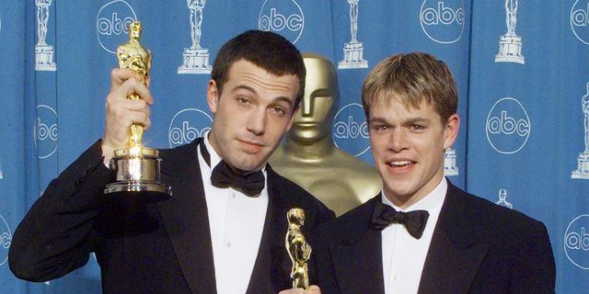 Two men posing with their Oscar