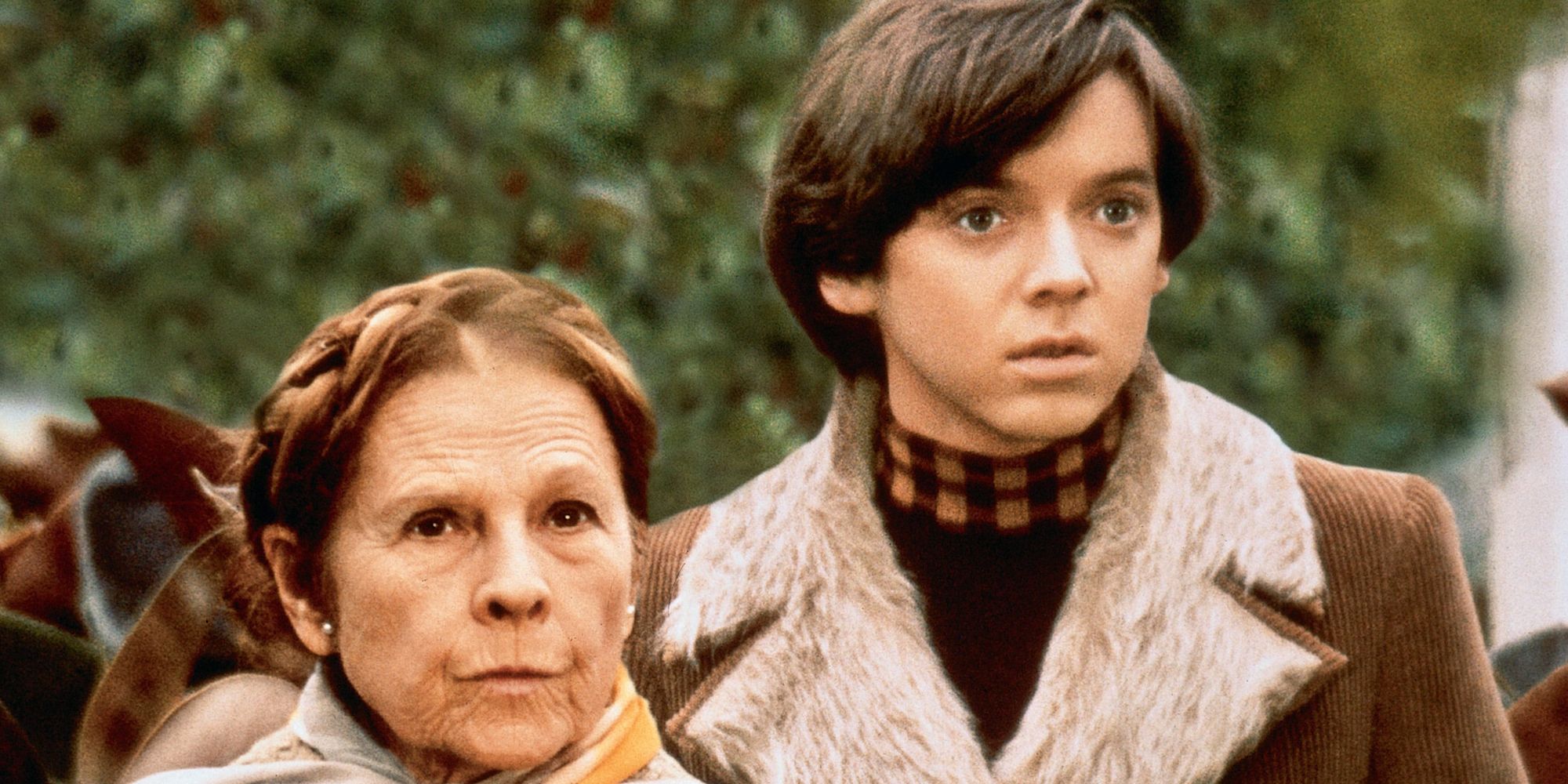 Harold and Maude looking ahead with serious expressions in Harold and Maude