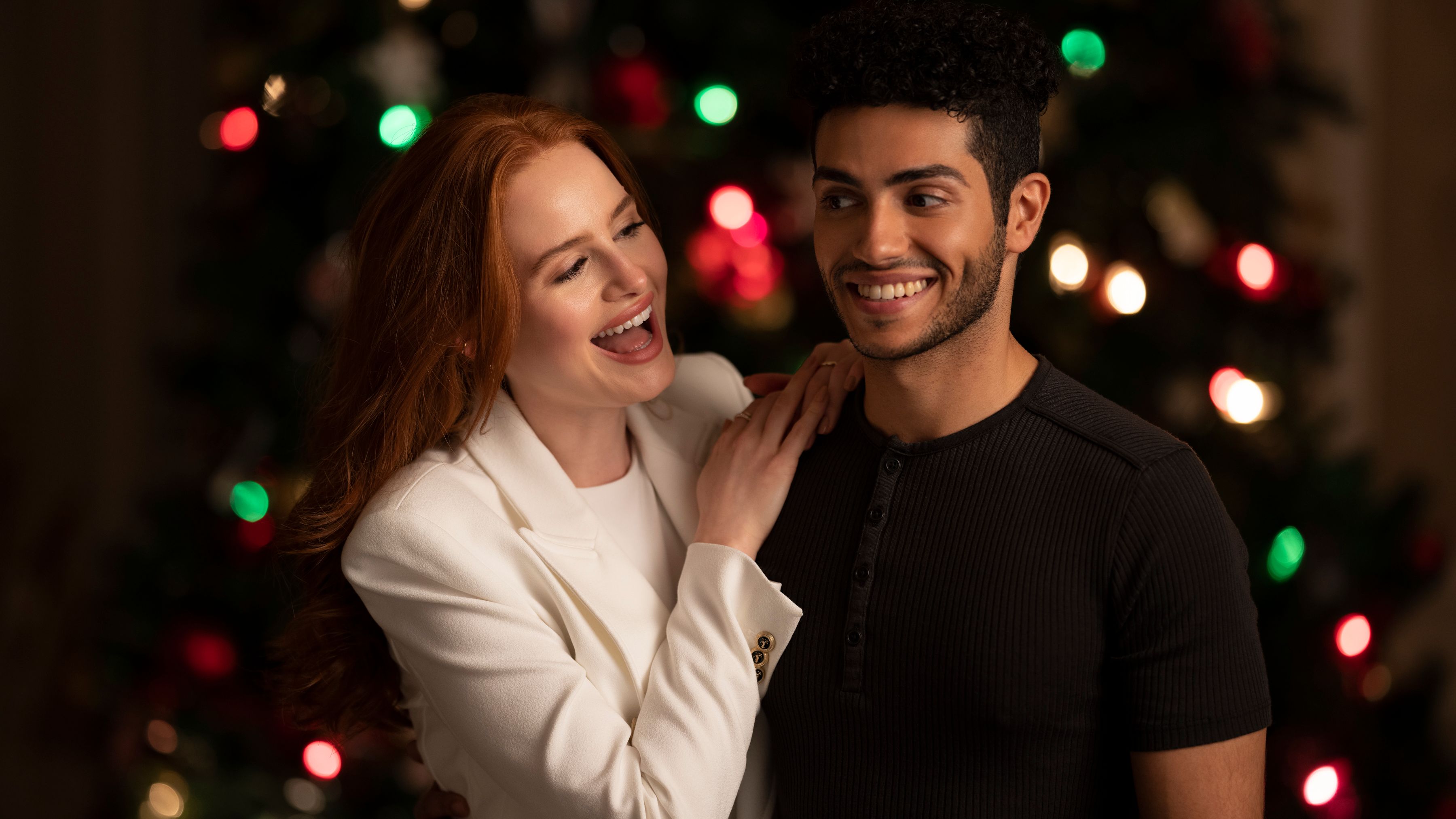 Madelaine Petsch and Mena Massoud in Hotel for the Holidays