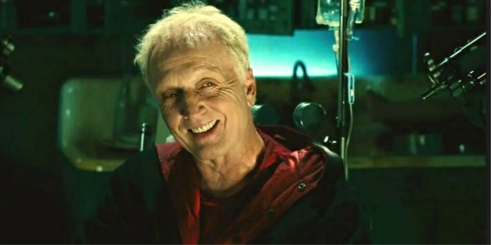 Jigsaw grins evilly in his workshop and signature black and red robe