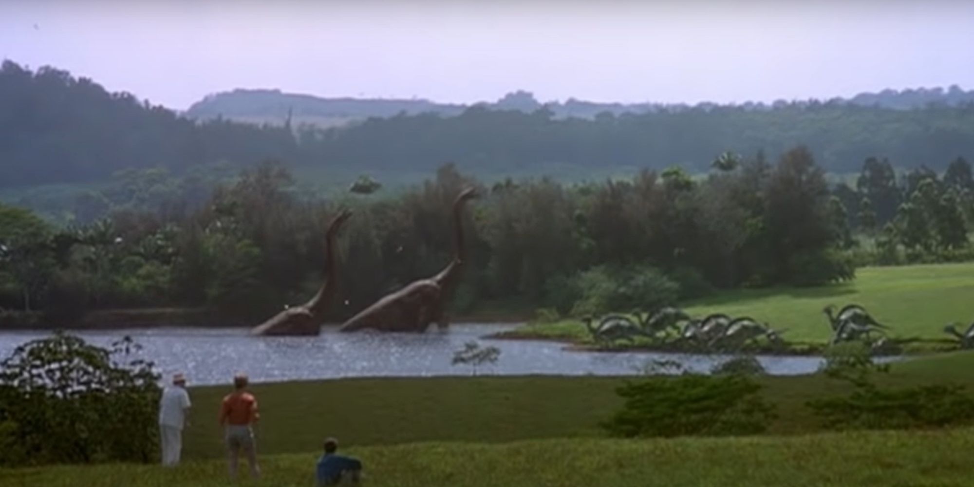 Onlookers watch as dinosaurs prowl the plains of Isla Nublar