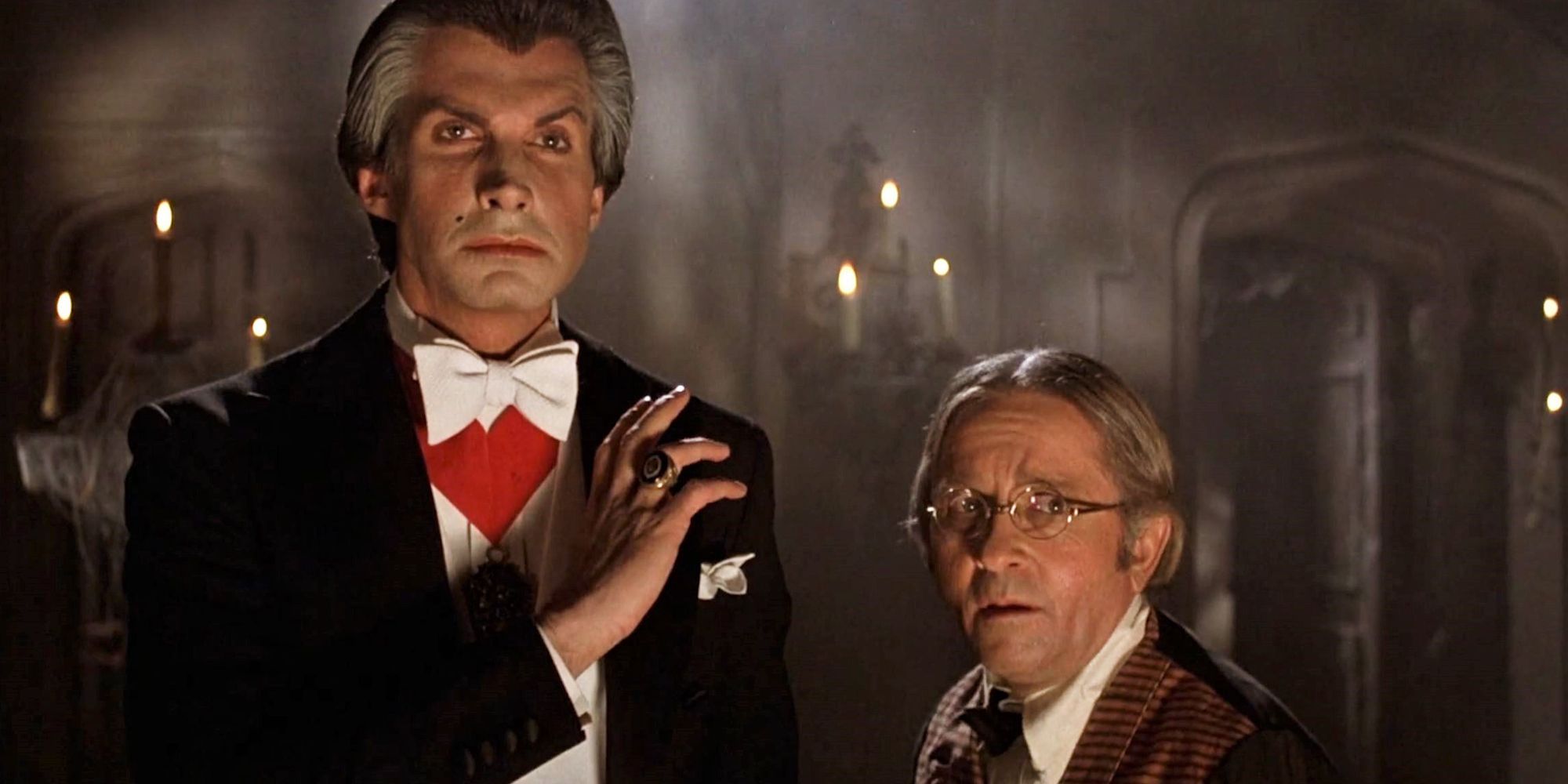 George Hamilton as Count Dracula standing next to Arte Johnson as Renfield in Love at First Bite