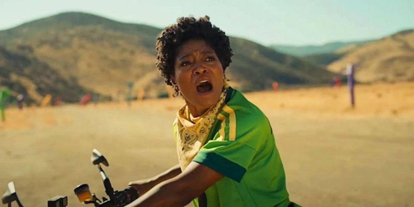 Emerald Haywood, played by actor Keke Palmer, riding a motorcycle and opening her mouth in shock in Nope